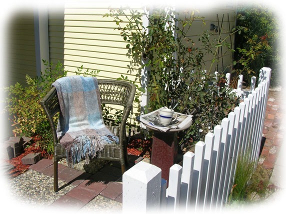 Garden chair by the picket fence